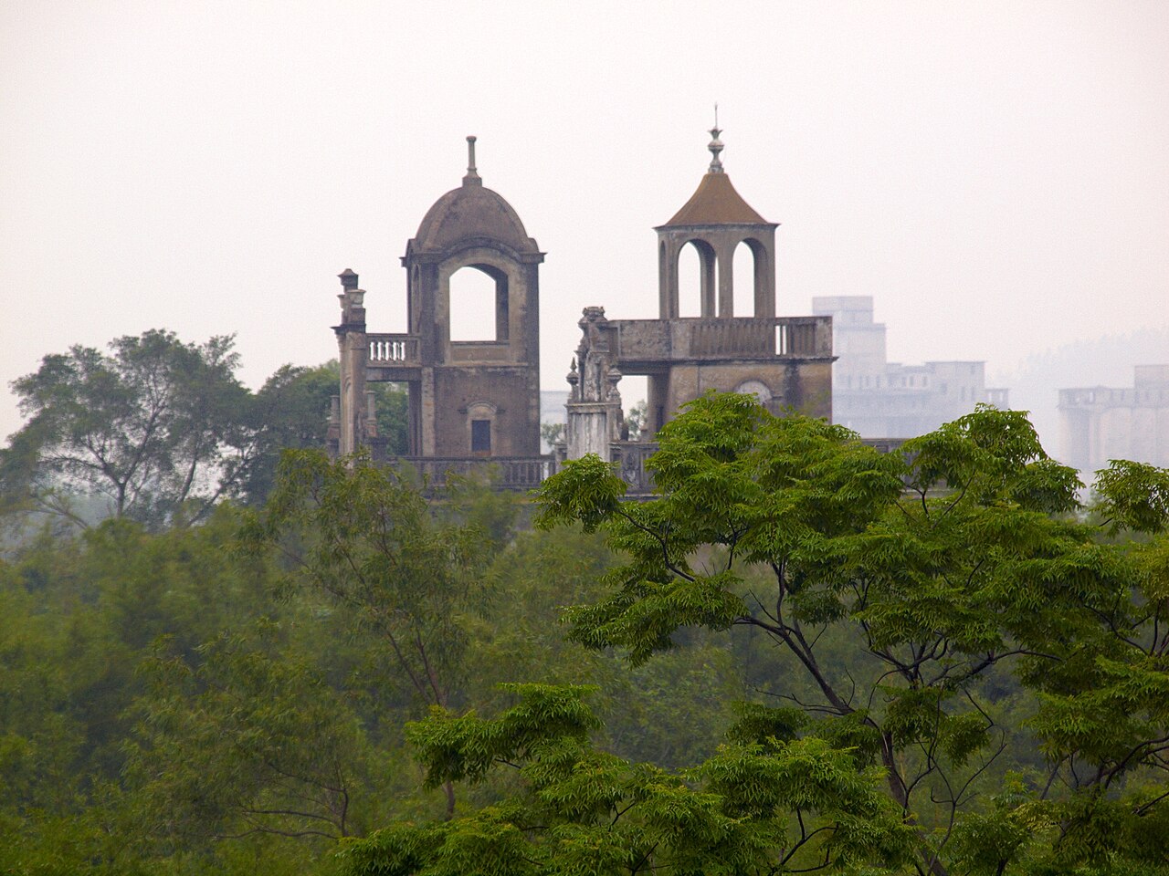 Diaolou rising above dense vegetation at Majianglong